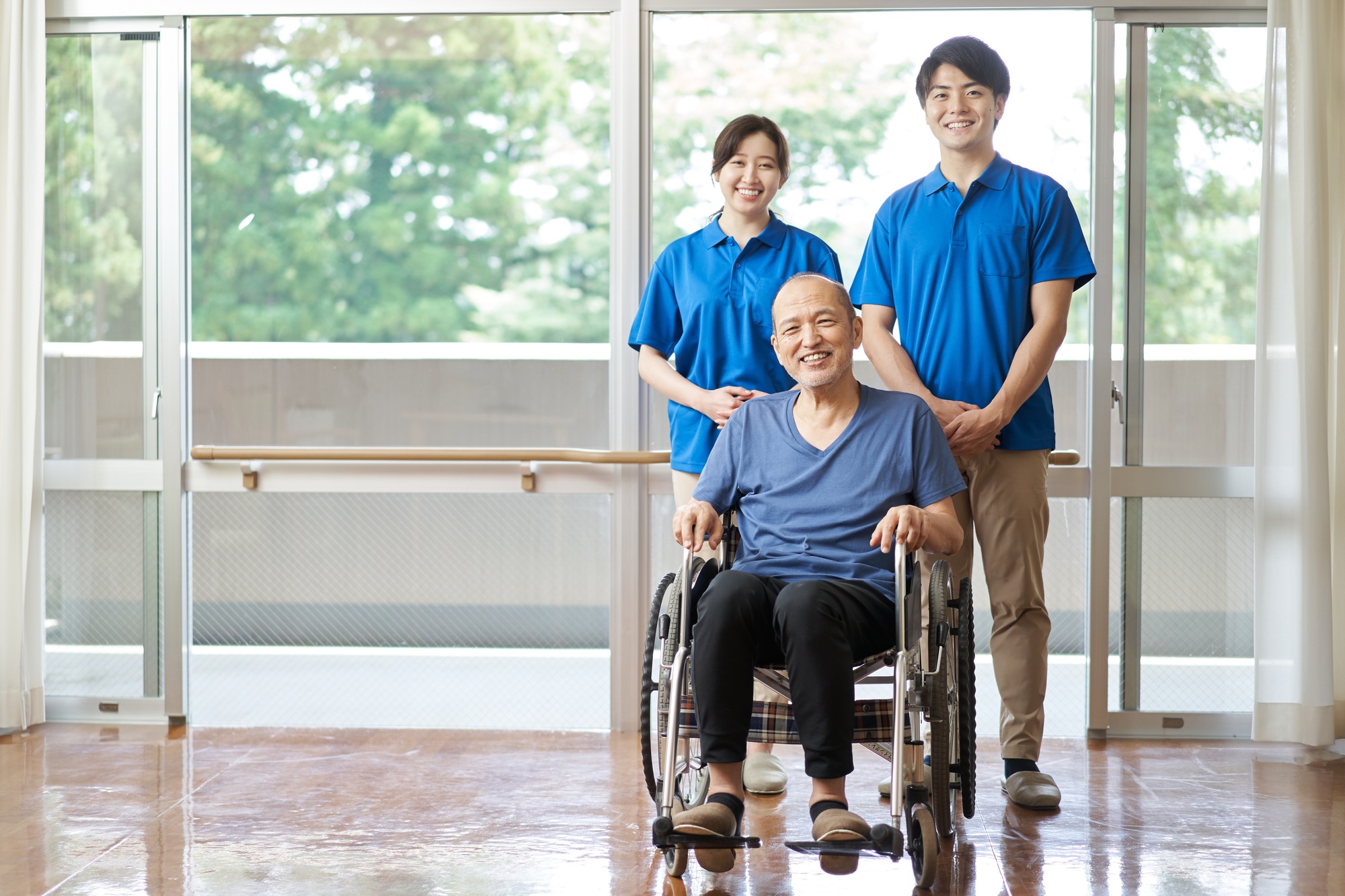 Asian elderly and male and female caregivers